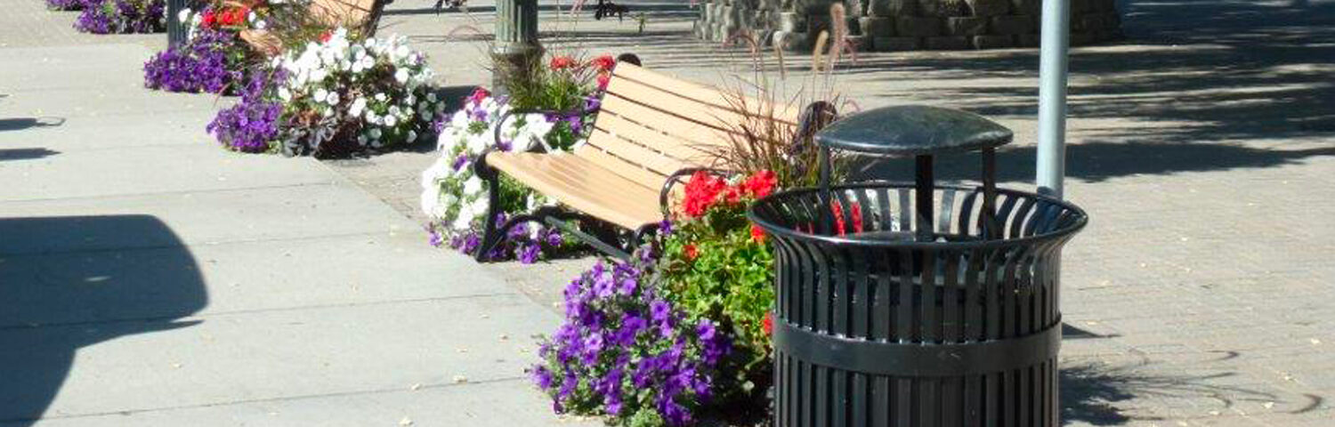 City benches with flower baskets